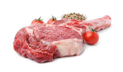 Piece of raw beef meat, spices and tomatoes isolated on white