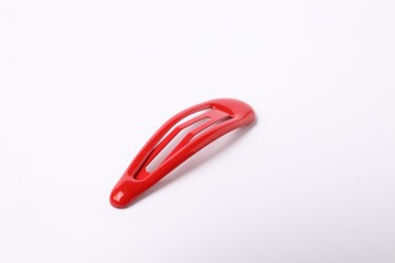 One red hair clip on white background
