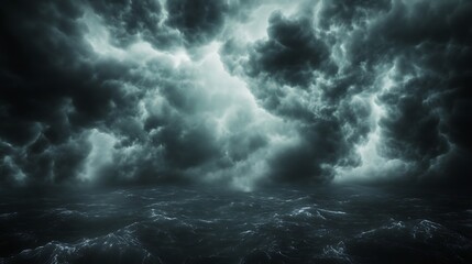 Obraz premium Dramatic dark clouds create an ominous atmosphere over a landscape.