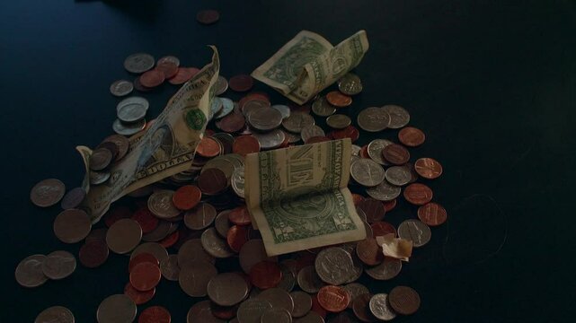 Handfull of Money Placed on a Countertop