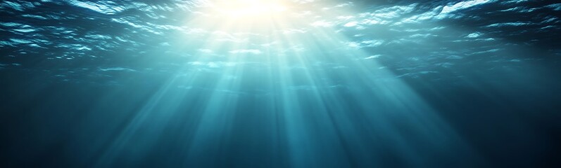 Obraz premium Underwater rays of light illuminating a serene aquatic scene.