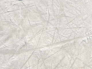 Ice background with marks from skating and hockey.