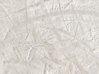 Ice background with marks from skating and hockey.