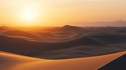 Obraz premium Desert Sunset: Golden Sands & Distant Mountains.