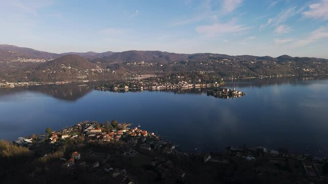 Pella village on Lake Orta in Northern Italy. Aerial drone panoramic and copy space
