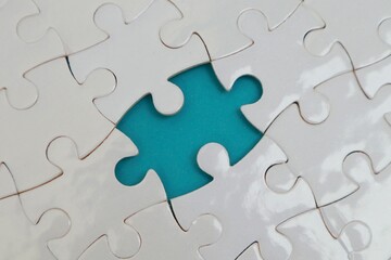 Incomplete white puzzles with blue backgrounds