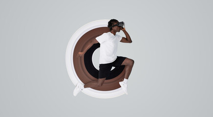 In motion shot of man wearing virtual reality headset running in studio, young african american guy immersed in digital workout experience, posing isolated against grey background, copy space