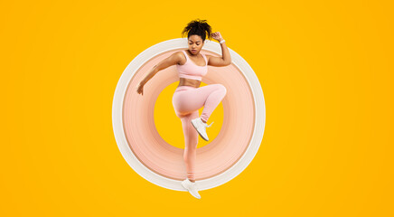 Vivid image of an african american lady in mid-air fitness routine, showcasing energy and liveliness, isolated against a yellow background