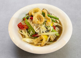 Spicy papaya salad with crispy pork skin