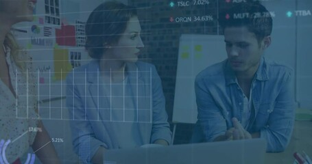 Business professionals discussing data analysis with stock market animation overlay
