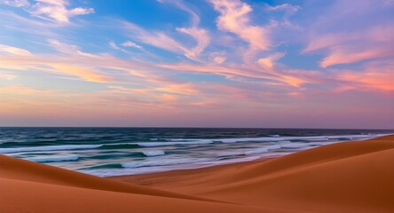 Obraz premium Colorful Sunset Over Calm Beach Waves