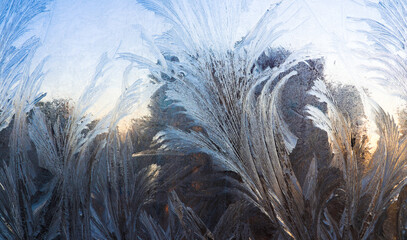 Abstract frosty pattern on glass, background texture.