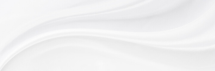 White gray satin texture that is white silver fabric silk panorama background with beautiful soft...