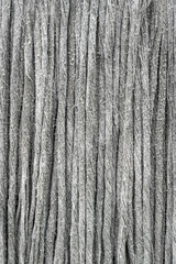 Close-up of old fabric with a gray-patterned texture.