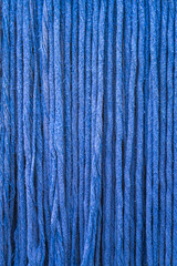 Close-up of old fabric with a blue patterned texture.