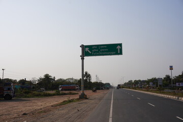 Direction road sign beside the highway 