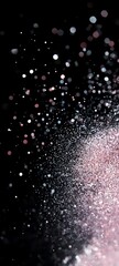 Sparkling Glitter Explosion on Black Background with Soft Pink and Silver