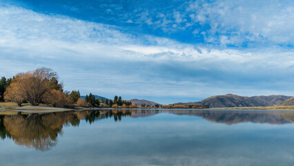 Fototapeta premium Reflections on Lake Camp one of several lakes in the Ashburton Lakes district