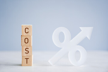 Wooden cubes with Cost and increasing percentage symbol, inflation, increasing cost of living, financial crisis concept