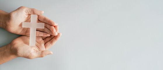 Hands holding white cross, Easter worship, thanks giving, prayer concept