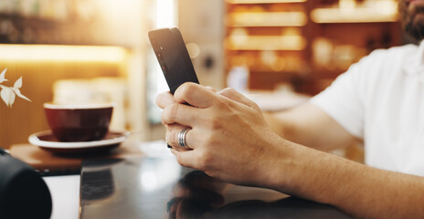 Hands, relax or man in cafe with phone for small business review, ratings or hospitality survey....