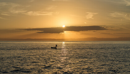 Seascape at Sunset - Calm Seas and Homeward-bound Boat