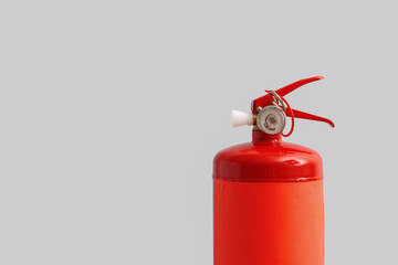 Fire extinguisher on grey background