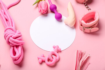 Blank card, sex toys and tulip flower on pink background, closeup