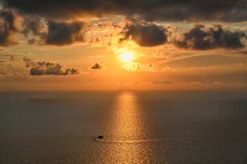Cruise on a tourist boat in the rays of a golden sunset