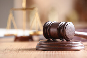 Judge's gavel on light table in office