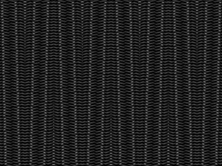 Black metal texture steel background. Perforated metal sheet. Texture of black carbon fiber.