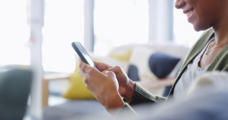 Happy, hands and typing with phone on sofa for text message notification, dating site and online scroll. Connection, person and smartphone in home for streaming service, app download or internet news