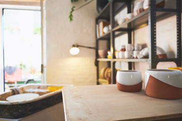 Ceramics, pots and small business with shelf for pottery, retail and manufacturing startup. Clay products, collection and handmade in workshop, craft store or production with creative tools in studio
