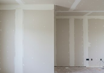 Unfinished drywall installation in new home under construction
