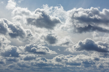 Dramatic cloudy sky with sunlight filtering through