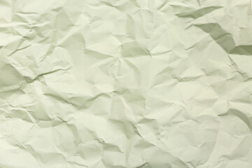 Texture of crumpled green paper as background