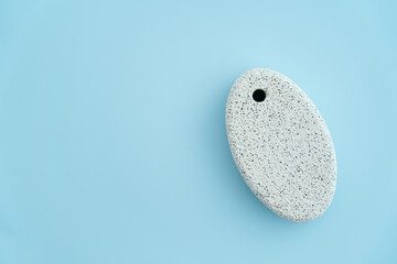 pumice stone isolated on blue background including copy space