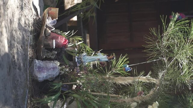 Vertical View of Altar for the Sea Goddess Lemanja on Sandy Ground in Uruguay - Handheld Shot