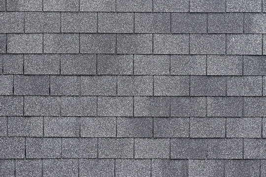 Texture of asphalt shingle​ wall. Abstract shingles bricks texture, Geometric pattern background, Details of wall material, Can be used as background for display or montage your products. Side view.