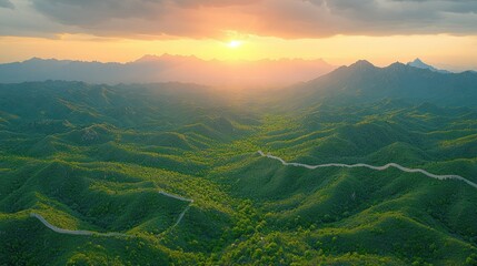 Majestic sunrise over the Great Wall winding through lush mountains