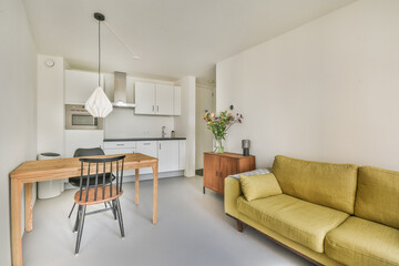 A contemporary living space showcasing a minimalist design with stylish furniture, calming colors, and natural light enhancing the atmosphere.