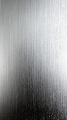 Brushed Metal Texture: A close-up captures the intricate texture of a brushed metal surface, revealing subtle patterns and a cool, metallic sheen. Perfect for abstract and industrial-themed projects.