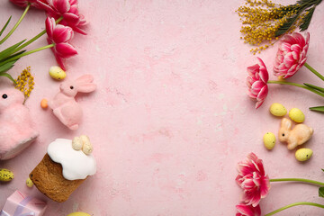 Frame made of Easter eggs, decorative rabbits and flowers on pink grunge background