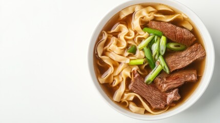 A bowl of comforting noodles and succulent beef served with a delicious broth and vibrant garnishes for flavor