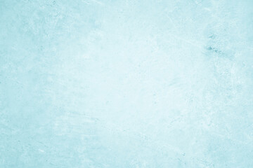 Grungy blue textured paper background with faded watercolor paint stains.