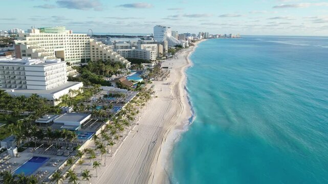 Stunning aerial view of a Cancun beach with hotels and turquoise water, playa delfines