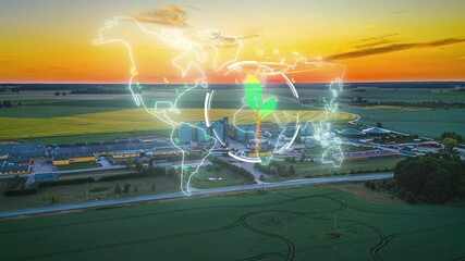 An Aerial View of an Agricultural Facility at Sunset Features a Glowing Digital Overlay of a World Map With a Sprouting Plant Symbol - Animation - Powered by Adobe