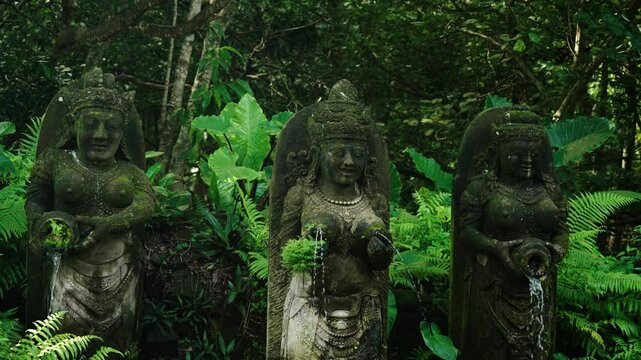 Moss-Covered Sculptures On The Ancient Temple In The Ubud Monkey Forest Of Bali, Indonesia. Close-up Shot