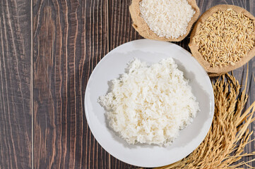 Fresh Cooked White Rice on Wooden Table with Raw Ingredients