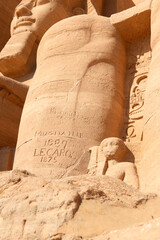 Smaller statues that depict the relatives of the Ramses II at entrance of the Great Temple of Abu...